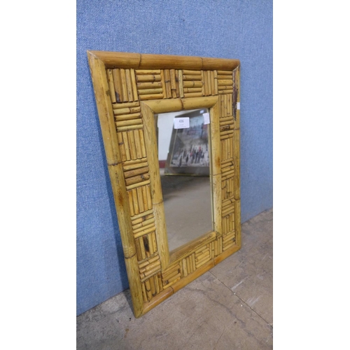 436 - A pine dressing table mirror and a bamboo mirror