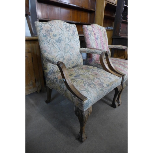 75 - A pair of 1930's carved mahogany and upholstered Gainsborough style open armchairs