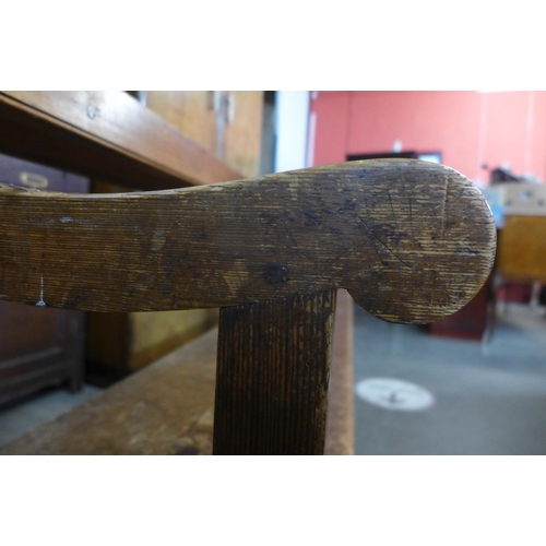 76 - An early 20th Century pine church pew, 86cms h, 204cms w, 50cms d