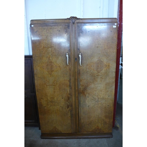 82 - A 1930's burr walnut wardrobe, 187cms h, 119cms w, 54cms d