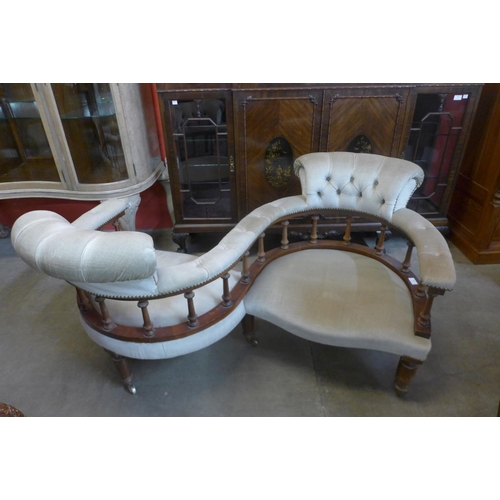 84 - A Victorian style mahogany and upholstered coversation seat, 73cms h, 131cms w, 100cms d