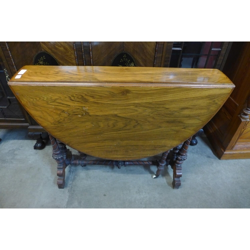 88 - A Victorian walnut Sutherland table, 71cms h x 88cms l