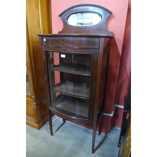 89 - An Edward VII inlaid mahogany bow front display cabinet, 150cms h, 64cms w, 40cms d