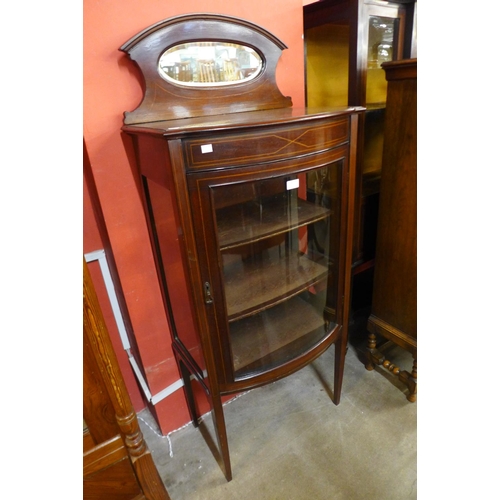 89 - An Edward VII inlaid mahogany bow front display cabinet, 150cms h, 64cms w, 40cms d