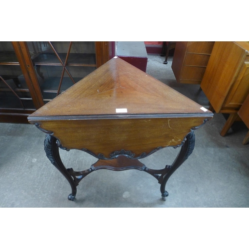 99 - An Edward VII mahogany drop leaf triangular occasional table, 73cms h