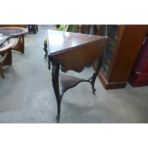 99 - An Edward VII mahogany drop leaf triangular occasional table, 73cms h