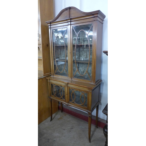 438 - An Edward VII inlaid mahogany display cabinet, 203cms h, 92cms w, 39cms d