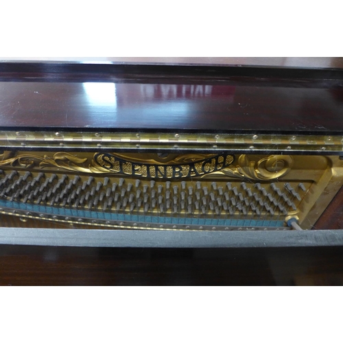 440 - An early 20th Century Steinbach mahogany overstrung upright piano