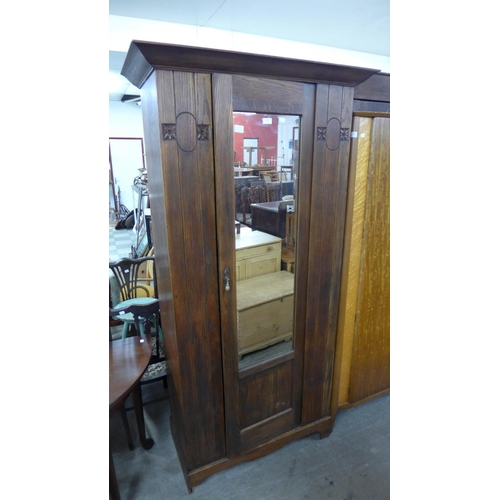 442 - An Arts and Crafts oak wardrobe