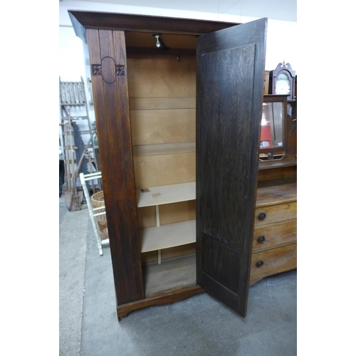 442 - An Arts and Crafts oak wardrobe