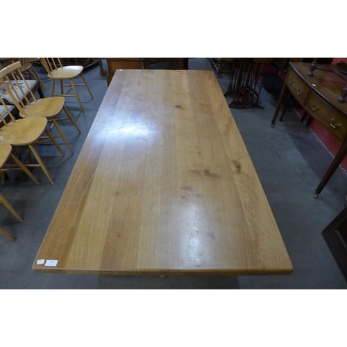 83 - An Arts and Crafts Cotswold School oak refectory table, 73cms h, 190cms l, 91cms w