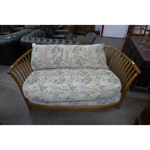 134 - An Ercol Golden Dawn elm settee