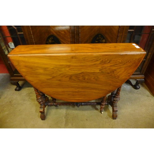 207 - A Victorian walnut Sutherland table, 71cms h x 88cms l