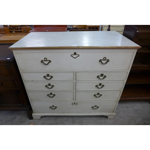 219 - A George III painted oak chest of drawers (top adapted to lift up)