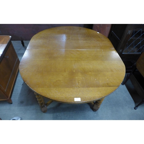 327 - An oak barleytwist draw-leaf table