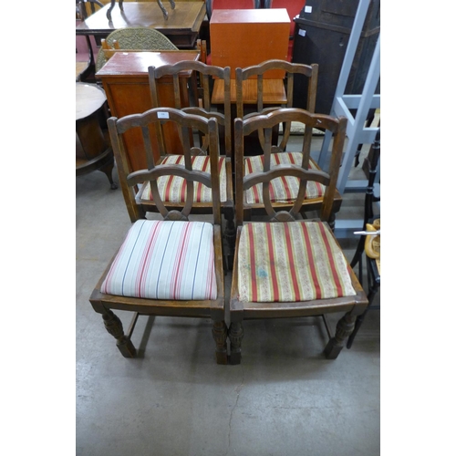 332 - A set of four oak dining chairs