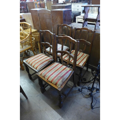 332 - A set of four oak dining chairs