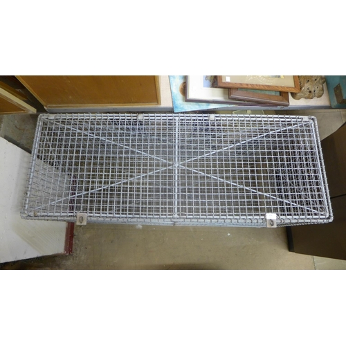 357 - A galvanised wirework storage cage, 70cms h, 122cms w, 46cms d