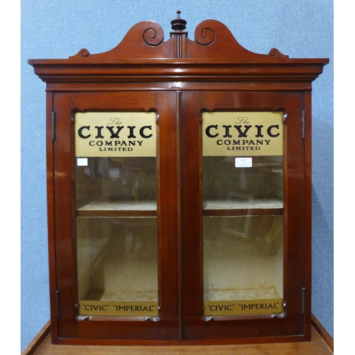 394 - A Victorian mahogany counter top shop cabinet, bearing Civic Company Limited inscription to doors, 7... 