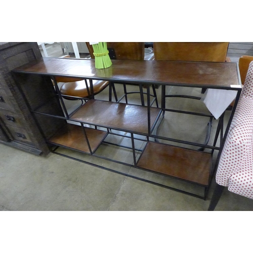 1331 - A steel and copper effect shelf unit  *This lot is subject to VAT