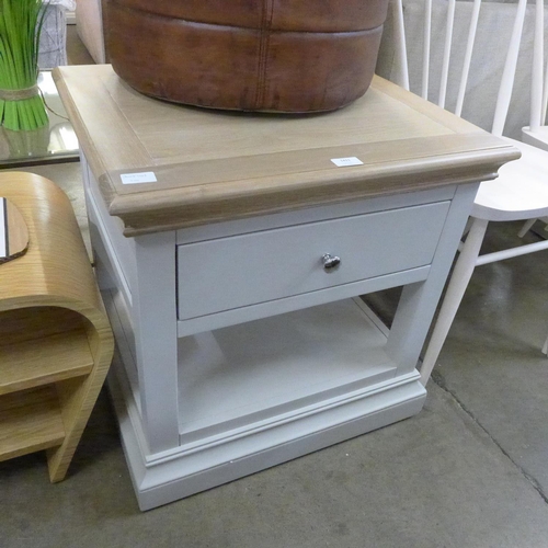 1350 - An oak and grey lamp table  *This lot is subject to VAT Damage to bottom right corner.