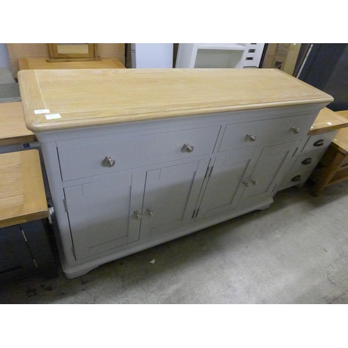 1369 - An oak and grey four door sideboard  *This lot is subject to VAT Slight marking.