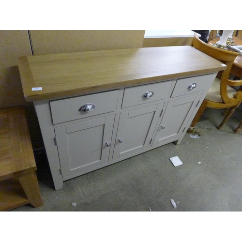 1374 - An oak and truffle three door sideboard  *This lot is subject to VAT