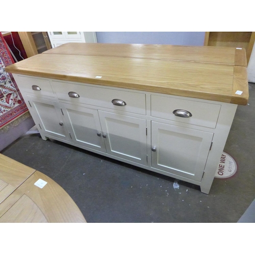 1463 - An oak and cream four door sideboard * this lot is subject to VAT - hole in back panel