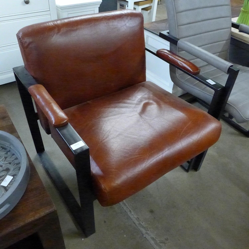 1473 - A brown leather armchair