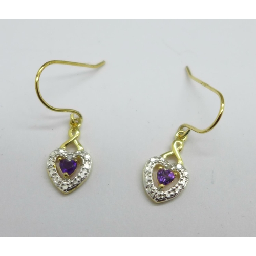 1043 - A pair of silver gilt, amethyst and diamond earrings