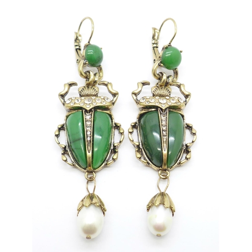 1061 - A pair of scarab beetle earrings