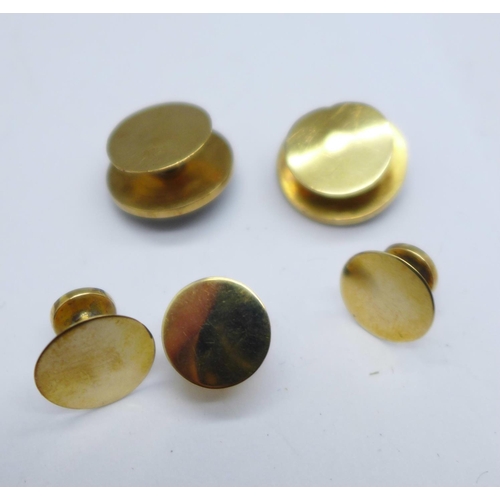 1062 - A cased set of yellow metal, onyx and seed pearl studs, 7.8g