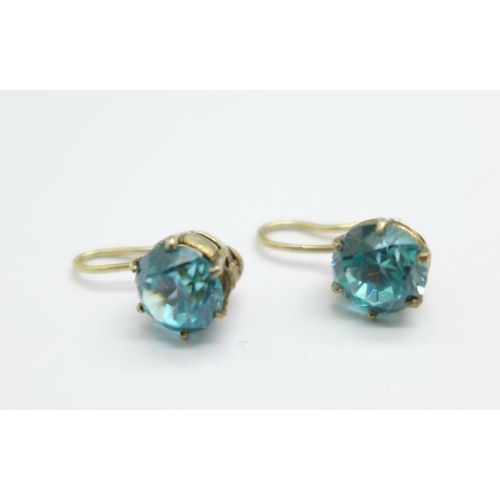 1079 - A pair of 1940's natural blue zircon earrings, set in yellow metal, stones approximately 1.1carats e... 