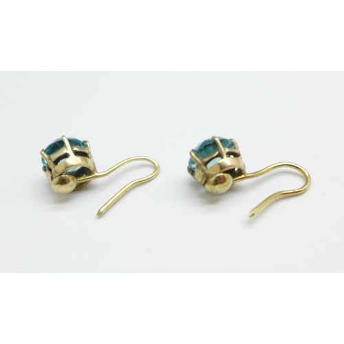 1079 - A pair of 1940's natural blue zircon earrings, set in yellow metal, stones approximately 1.1carats e... 