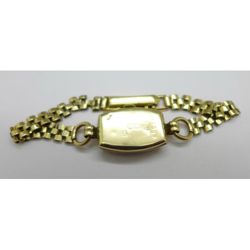 1082 - A 9ct gold cased lady's wristwatch with 9ct gold bracelet strap, weight without movement 8.8g