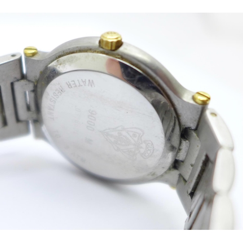 1101 - A yellow metal and stainless steel Gucci dress wristwatch