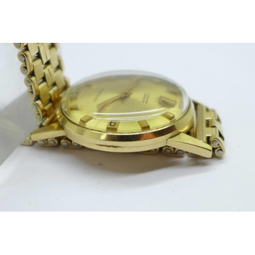 1111 - A 9ct gold cased Excalibur automatic wristwatch, (Tissot 1481 movement), rolled gold bracelet