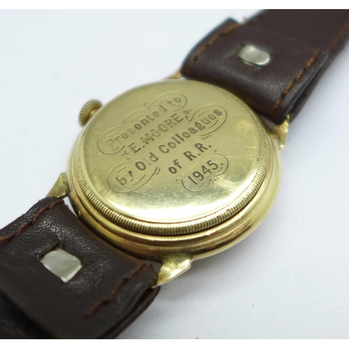 1114 - A 9ct gold cased wristwatch, the screw back case bears inscription dated 1945, 29mm case