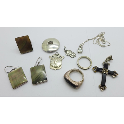 1141 - A pair of silver earrings and a matching ring, K/L, other silver jewellery including a cross, two ri... 