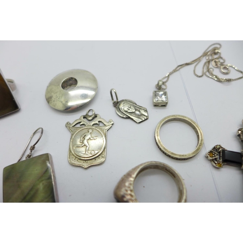 1141 - A pair of silver earrings and a matching ring, K/L, other silver jewellery including a cross, two ri... 