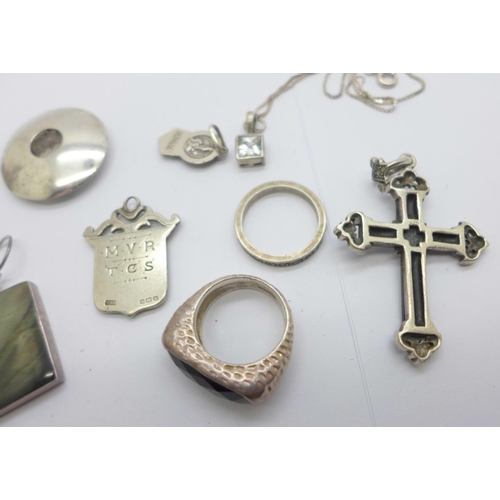 1141 - A pair of silver earrings and a matching ring, K/L, other silver jewellery including a cross, two ri... 