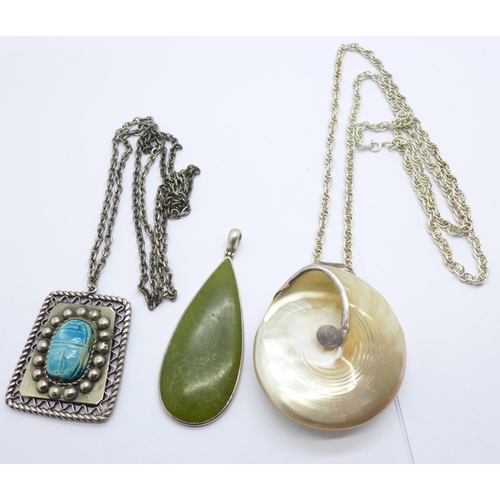 1151 - Two silver mounted pendants, a silver chain and a white metal scarab beetle pendant and chain