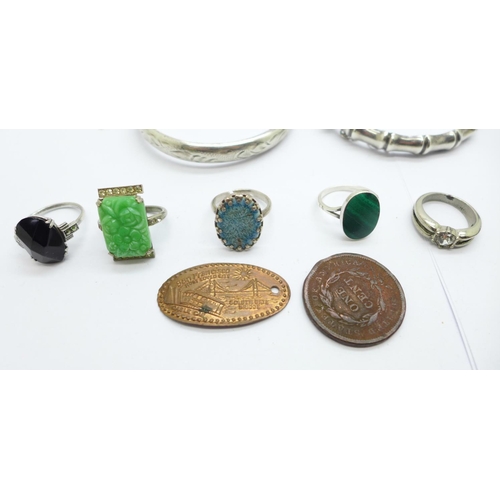 1152 - Two silver bangles, an Irish regimental badge, a silver date pendant, three silver rings, two other ... 