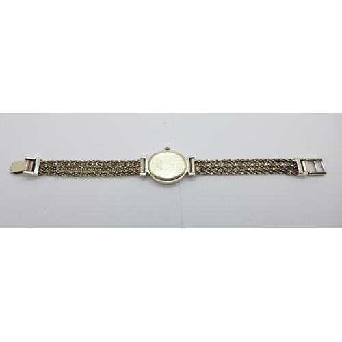 1153 - A silver wristwatch with mother of pearl dial