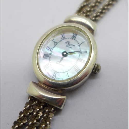 1153 - A silver wristwatch with mother of pearl dial