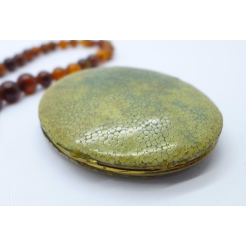 1157 - A Kigu shagreen compact and a necklace