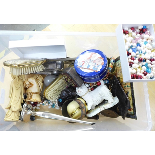 1171 - A box of assorted items including three chinese figures, plated ware, advertising tins, loose beads ... 