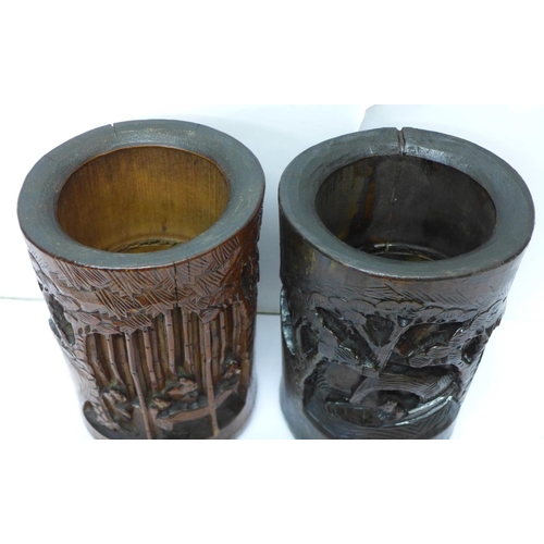 603 - Two Chinese carved bamboo brush pots, one stained, 20cm