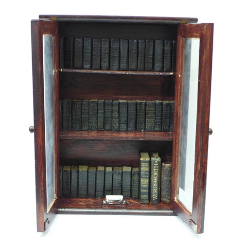 610 - A set of miniature books, Works of Shakespeare, thirty-nine volumes and three others in a glazed boo... 