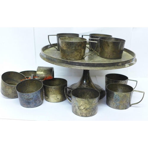 619 - A Geo. Abrahamson Newman Galleries set of twelve silver plated cup holders and stand